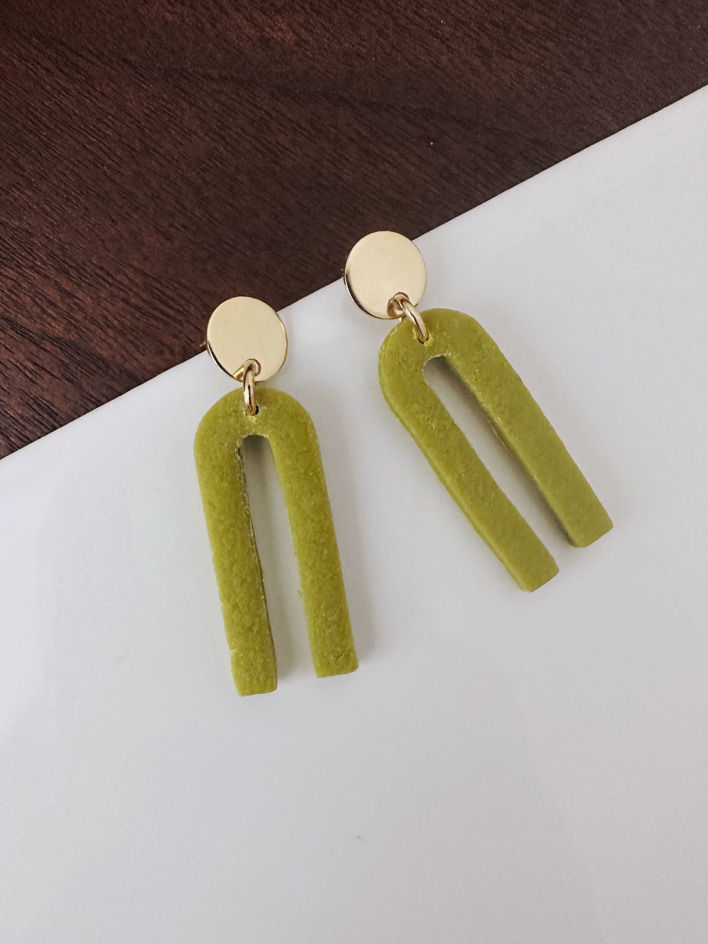 avocado green small arch earrings with gold circle topper